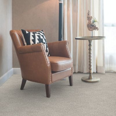 beige carpets in a lafayette living room with arm chair and side table
